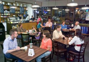 Patrons seated in a coffee shop.