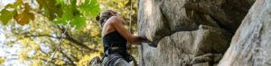 A rock climber high on a steep rock