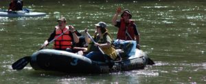 Raft full of people on a river